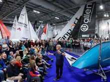 The crowd pays no attention as the Flying Fifteen behind them calls 'Starboard' on an 18-foot Skiff